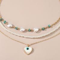 Simple Style Devil's Eye Heart Shape Turquoise Imitation Pearl Alloy Metal Wholesale Necklace main image 2