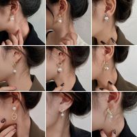 1 Pair Elegant Letter Bow Knot Inlay Metal Copper Pearl Zircon Drop Earrings main image 1