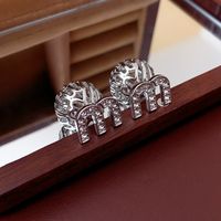 1 Pair Lady Letter Plating Hollow Out Inlay Copper Zircon Ear Studs main image 1