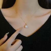 Vintage Style Simple Style Bow Knot Copper Irregular Plating Inlay Artificial Pearls Gold Plated Pendant Necklace main image 4