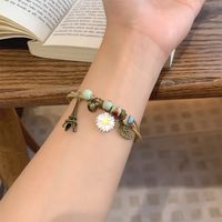 Casual Simple Style Four Leaf Clover Butterfly Daisy Baroque Pearls Ceramics Beaded Plating Braid White Gold Plated Women's Bracelets main image 9