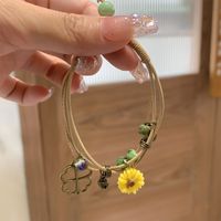 Lässig Einfacher Stil Vierblättriges Kleeblatt Schmetterling Gänseblümchen Barocke Perlen Keramik Perlen Überzug Flechten Weißgold Plattiert Frau Armbänder main image 7