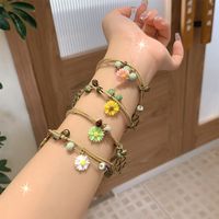 Casual Simple Style Four Leaf Clover Butterfly Daisy Baroque Pearls Ceramics Beaded Plating Braid White Gold Plated Women's Bracelets main image 1
