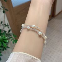 Casual Simple Style Four Leaf Clover Butterfly Daisy Baroque Pearls Ceramics Beaded Plating Braid White Gold Plated Women's Bracelets main image 6