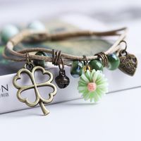 Casual Simple Style Four Leaf Clover Butterfly Daisy Baroque Pearls Ceramics Beaded Plating Braid White Gold Plated Women's Bracelets main image 8