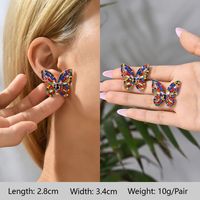 1 Pair Exaggerated Luxurious Shiny Round Heart Shape Wings Plating Inlay Copper Alloy Zinc Alloy Rhinestones Glass Ear Studs sku image 1