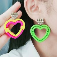 1 Pair Simple Style Heart Shape Spray Paint Hollow Out Arylic Drop Earrings main image 2