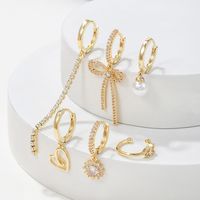 1 Set Elegant Simple Style Tassel Heart Shape Bow Knot Plating Inlay Imitation Pearl Brass Zircon 18k Gold Plated Earrings main image 3