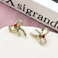 1 Pair Simple Style Bow Knot Inlay Alloy Zircon Ear Studs main image 3