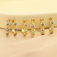 1 Pair Retro Simple Style Devil's Eye Plating Inlay Copper Zircon 18k Gold Plated Hoop Earrings main image 1