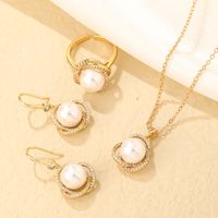 Wholesale Sweet Geometric Round Stainless Steel Copper Plating Inlay Gold Plated Pearl Zircon Earrings Necklace main image 1
