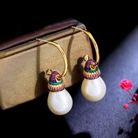 1 Pair Vintage Style Ethnic Style Sweet Geometric Plating Inlay Imitation Pearl Copper Copper Alloy Artificial Diamond Drop Earrings main image 1