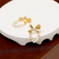 1 Pair Sweet Simple Style Bow Knot Plating Inlay Freshwater Pearl Copper Zircon 18k Gold Plated Earrings main image 2