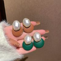 1 Pair Elegant Color Block Inlay Pu Leather Alloy Artificial Pearls Ear Studs main image 1