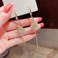 1 Pair Simple Style Streetwear Glittery Letter Rhombus Plating Inlay Alloy Copper Alloy Rhinestones Gold Plated Drop Earrings main image 2