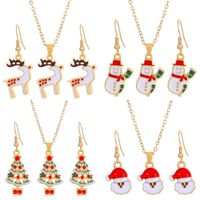 Christmas Classic Style Christmas Hat Christmas Tree Santa Claus Alloy Enamel Plating Inlay Artificial Rhinestones 18k Gold Plated Gold Plated Women's Earrings Necklace main image 4