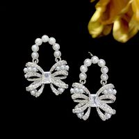 1 Pair Lolita Bow Knot Inlay Copper Artificial Pearls Zircon Drop Earrings main image 1
