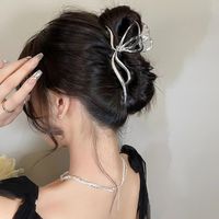 امرأة نمط Ig أنيق عقدة القوس سبيكة تصفيح مخالب الشعر main image 1