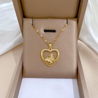 Wholesale IG Style Shiny Heart Shape Butterfly Titanium Steel Copper Hollow Out Inlay Zircon Pendant Necklace main image 1