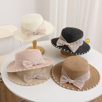 Women's Simple Style Solid Color Bowknot Wide Eaves Straw Hat main image 1