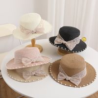 Women's Simple Style Solid Color Bowknot Wide Eaves Straw Hat main image 6