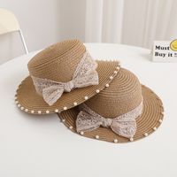 Women's Simple Style Solid Color Bowknot Wide Eaves Straw Hat main image 2