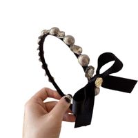 Women's Sweet Simple Style Bow Knot Imitation Pearl Inlay Artificial Pearls Rhinestones Hair Band main image 2