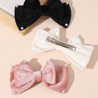 Women's Cute Sweet Bow Knot Alloy Cloth Flannel Inlay Artificial Pearls Hair Clip main image 4