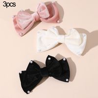 Women's Cute Sweet Bow Knot Alloy Cloth Flannel Inlay Artificial Pearls Hair Clip main image 1