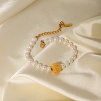 Großhandel Schmuck IG-Stil Blume Edelstahl 304 Künstliche Perle Titan Stahl 18 Karat Vergoldet Armbänder main image 1