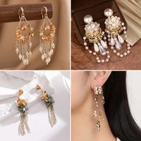 1 Pair Glam Shiny Water Droplets Tassel Flower Plating Inlay Copper Artificial Crystal Artificial Pearls Drop Earrings main image 1