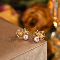 1 Pair Sweet Crown Bow Knot Plating Inlay Copper Alloy Artificial Pearls Zircon Ear Studs main image 3