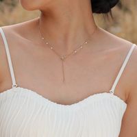 201 Stainless Steel IG Style Plating Inlay Bow Knot Artificial Pearls Pendant Necklace main image 3
