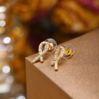 1 Pair Sweet Crown Bow Knot Plating Inlay Copper Alloy Artificial Pearls Zircon Ear Studs main image 9