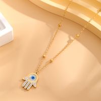 304 Stainless Steel Simple Style Plating Inlay Devil's Eye Palm Rhinestones Shell Pendant Necklace main image 1