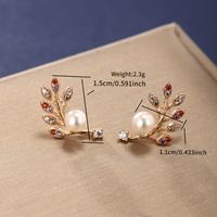 1 Pair Elegant Xuping Sweet Leaf Round Plating Inlay Alloy Copper Alloy Artificial Gemstones Artificial Pearls 18k Gold Plated Ear Studs main image 6