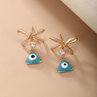 1 Pair Vintage Style Xuping Triangle Bow Knot Irregular Plating Inlay Alloy Copper Alloy Artificial Gemstones 18k Gold Plated Drop Earrings main image 3