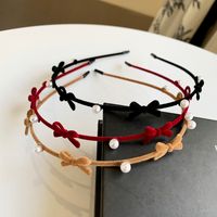 Women's Cute Bow Knot Flannel Suede Inlay Artificial Pearls Hair Band main image 1