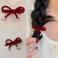 Women's Cute Sweet Bow Knot Flannel Flocking Inlay Artificial Pearls Hair Clip main image 1