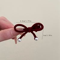 Women's Cute Sweet Bow Knot Flannel Flocking Inlay Artificial Pearls Hair Clip main image 2