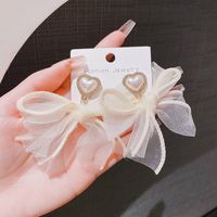 1 Pair Elegant Sweet Heart Shape Bow Knot Plating Inlay Alloy Artificial Pearls Rhinestones Drop Earrings main image 1
