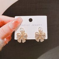1 Pair Elegant Simple Style Flower Bow Knot Plating Inlay Alloy Artificial Pearls Rhinestones Drop Earrings main image 3