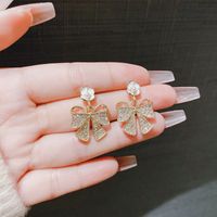 1 Pair Elegant Simple Style Flower Bow Knot Plating Inlay Alloy Artificial Pearls Rhinestones Drop Earrings main image 2