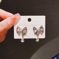 1 Pair Simple Style Water Droplets Bow Knot Plating Inlay Alloy Artificial Pearls Rhinestones Drop Earrings main image 3