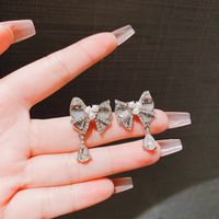 1 Pair Simple Style Water Droplets Bow Knot Plating Inlay Alloy Artificial Pearls Rhinestones Drop Earrings main image 4