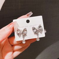 1 Pair Simple Style Water Droplets Bow Knot Plating Inlay Alloy Artificial Pearls Rhinestones Drop Earrings main image 2