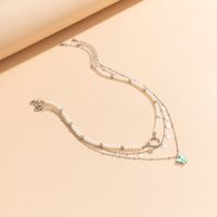 Sweet Cool Style Round Butterfly Imitation Pearl Copper Tassel Inlay Acrylic Women's Three Layer Necklace main image 4