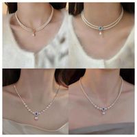 Simple Style Classic Style Solid Color Imitation Pearl Alloy Beaded Women's Layered Necklaces Necklace main image 1