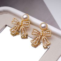 1 Paar Elegant Bogenknoten Inlay Kupfer Perle 18 Karat Vergoldet Tropfenohrringe main image 1
