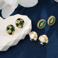 1 Pair Nordic Style XUPING Simple Style Oval Football Enamel Inlay 304 Stainless Steel Artificial Gemstones 18K Gold Plated Ear Studs main image 1